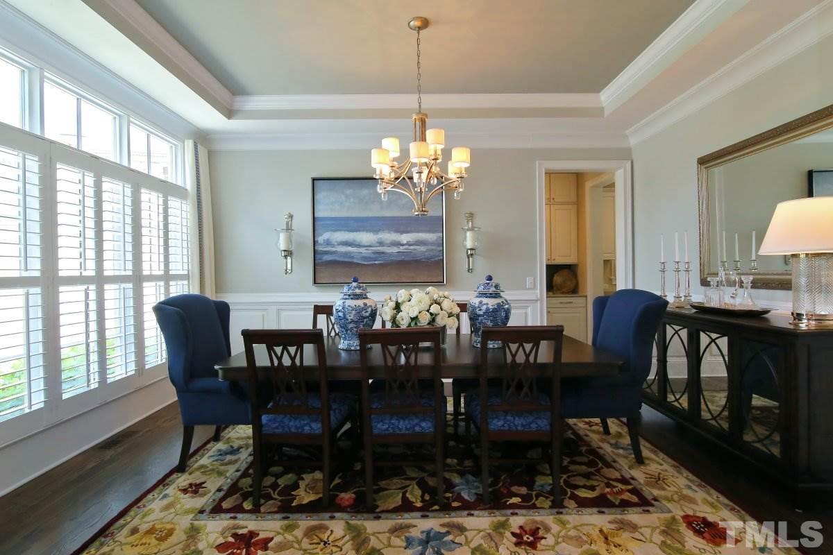 4106 English Garden Way Raleigh, NC 27612 - Photo 3 of 25 Tray ceiling with extensive crown molding and wainscoting.