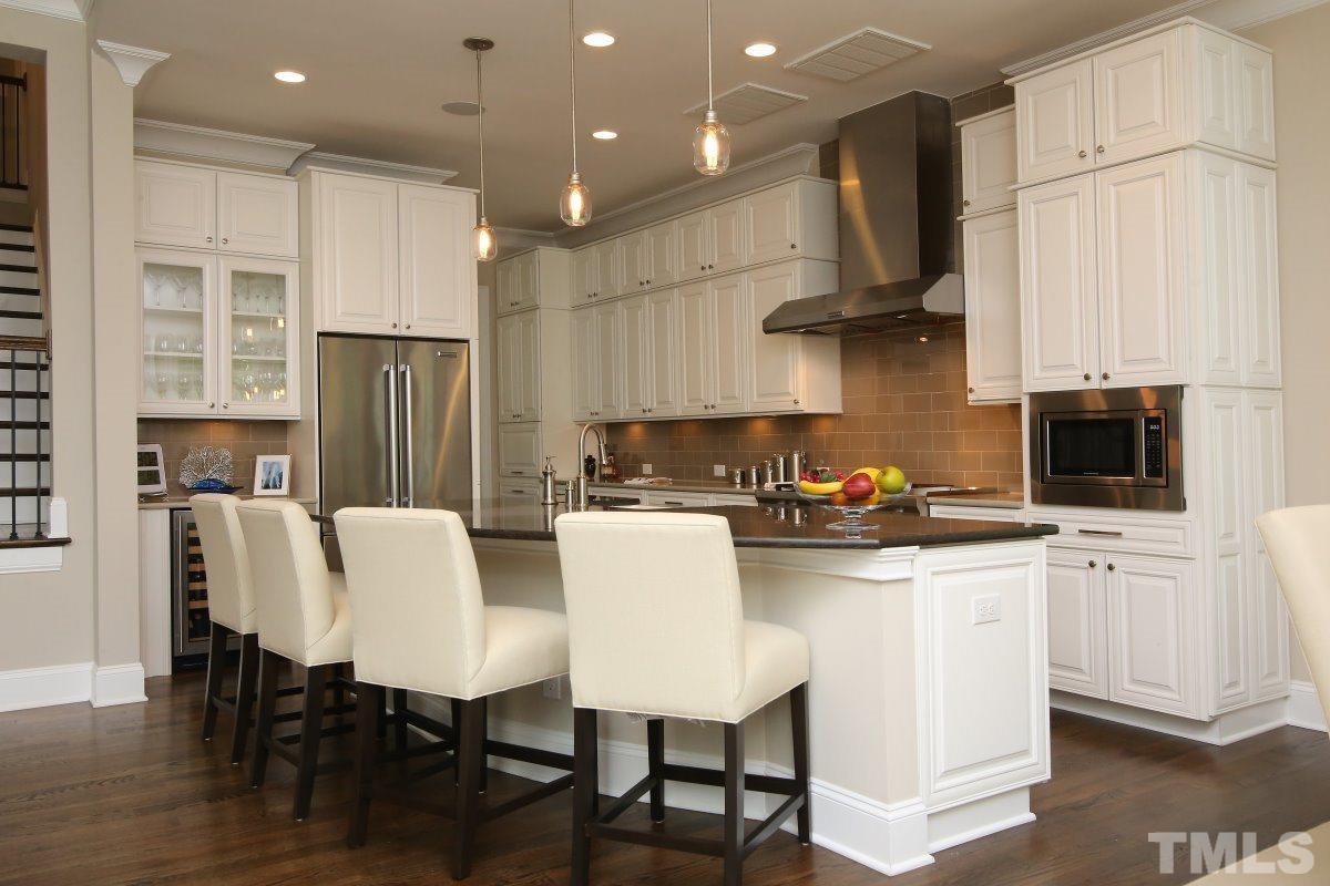 4106 English Garden Way Raleigh, NC 27612 - Photo 8 of 25 Large kitchen with oversized island. Quartz countertops.