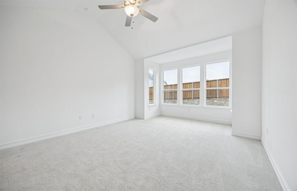 11216 Abbotsbury Road Fort Worth, TX 76052 - Photo 10 of 20 an empty room with chandelier fan