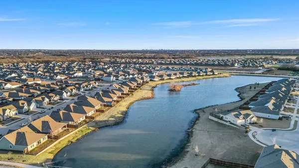 an aerial view of a house with a ocean view