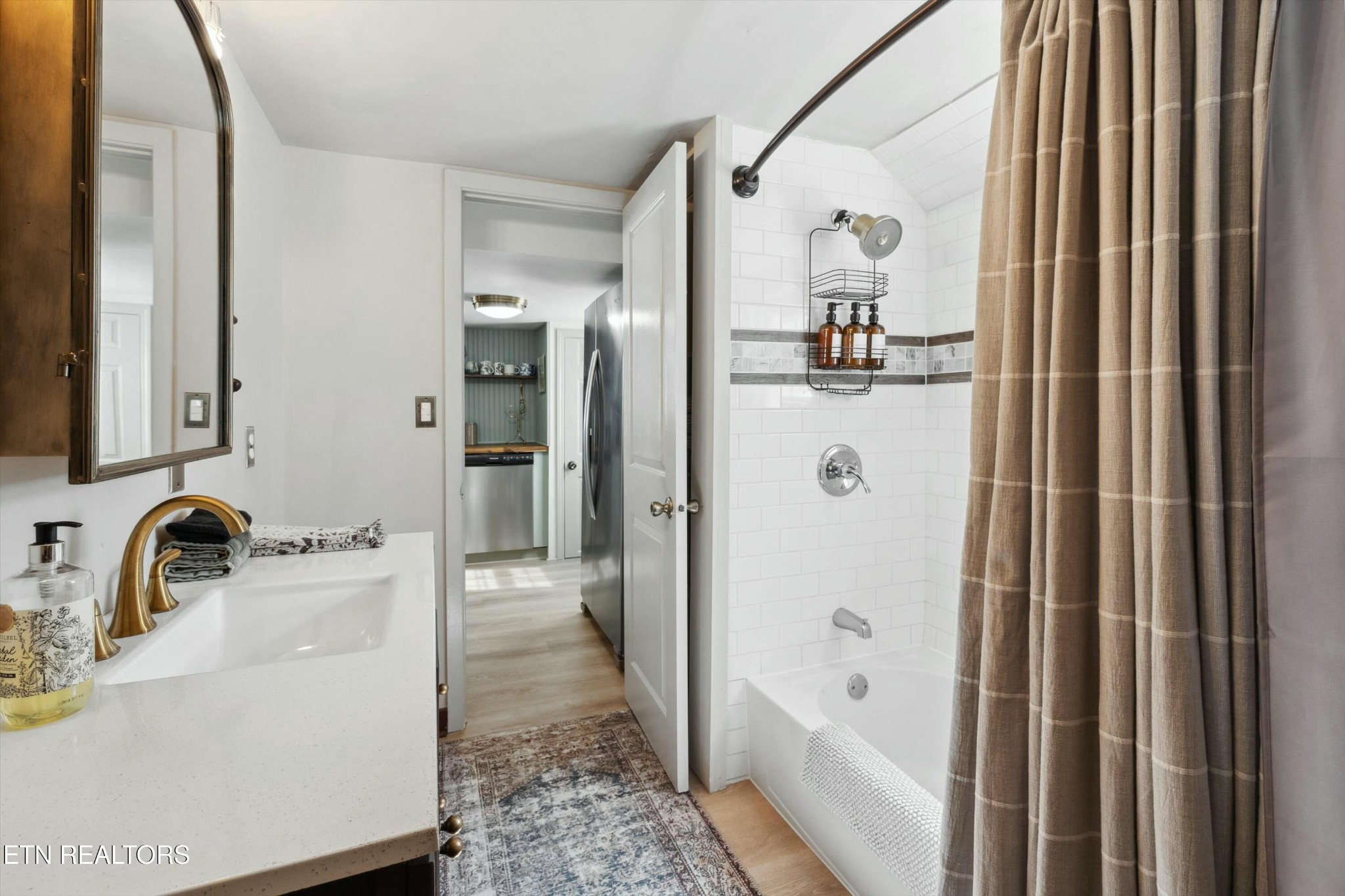1216 Powder Springs Road Sevierville, TN 37876 - Photo 17 of 45 a bathroom with a bathtub and a shower