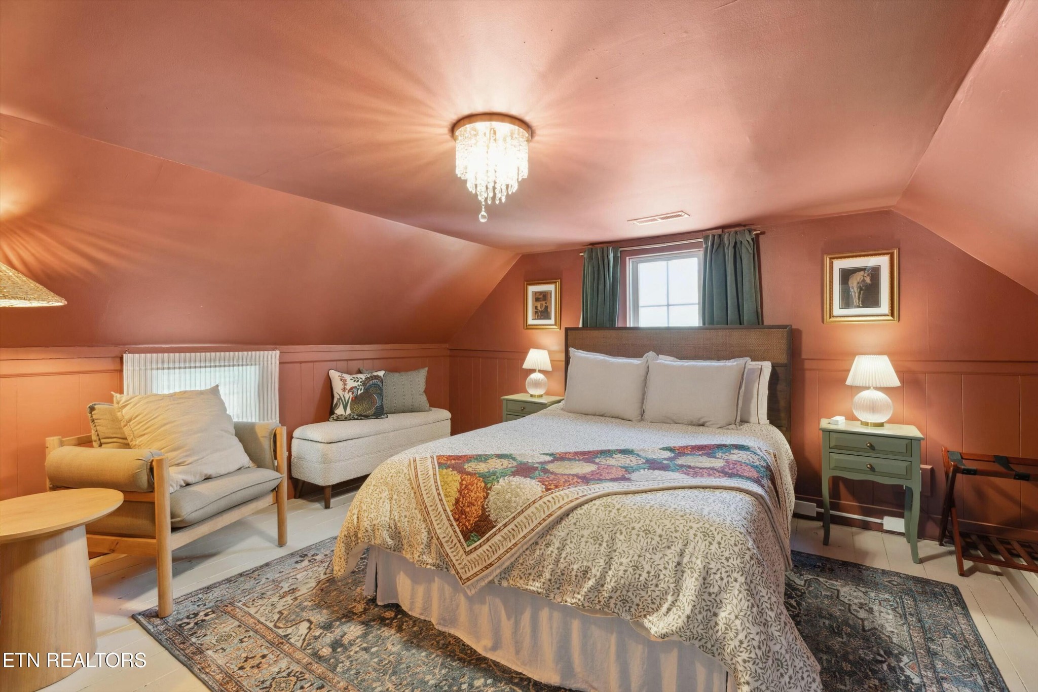 1216 Powder Springs Road Sevierville, TN 37876 - Photo 26 of 45 a spacious bedroom with a bed and lamp chandelier