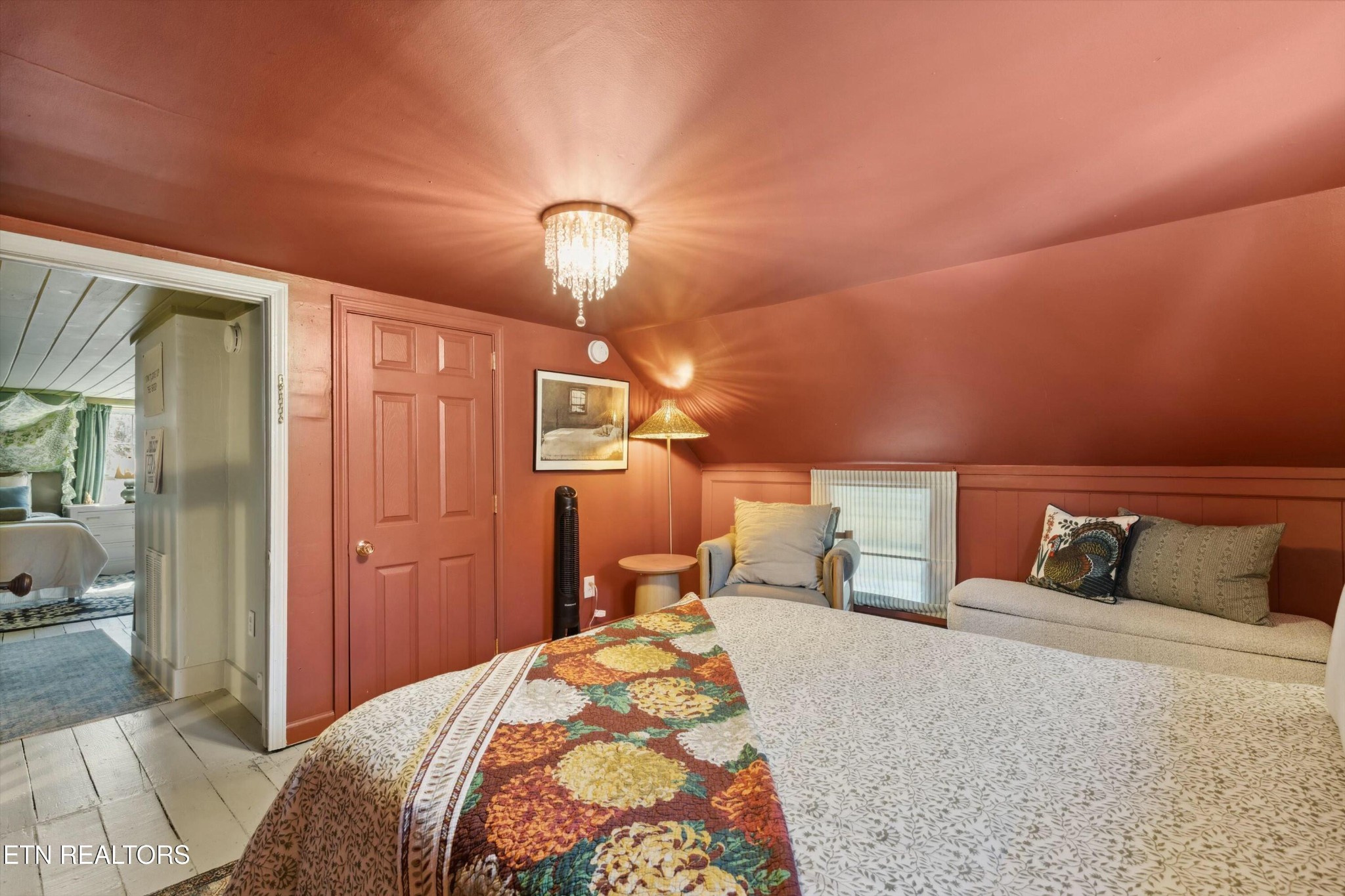 1216 Powder Springs Road Sevierville, TN 37876 - Photo 27 of 45 a bedroom with a bed and wooden floor