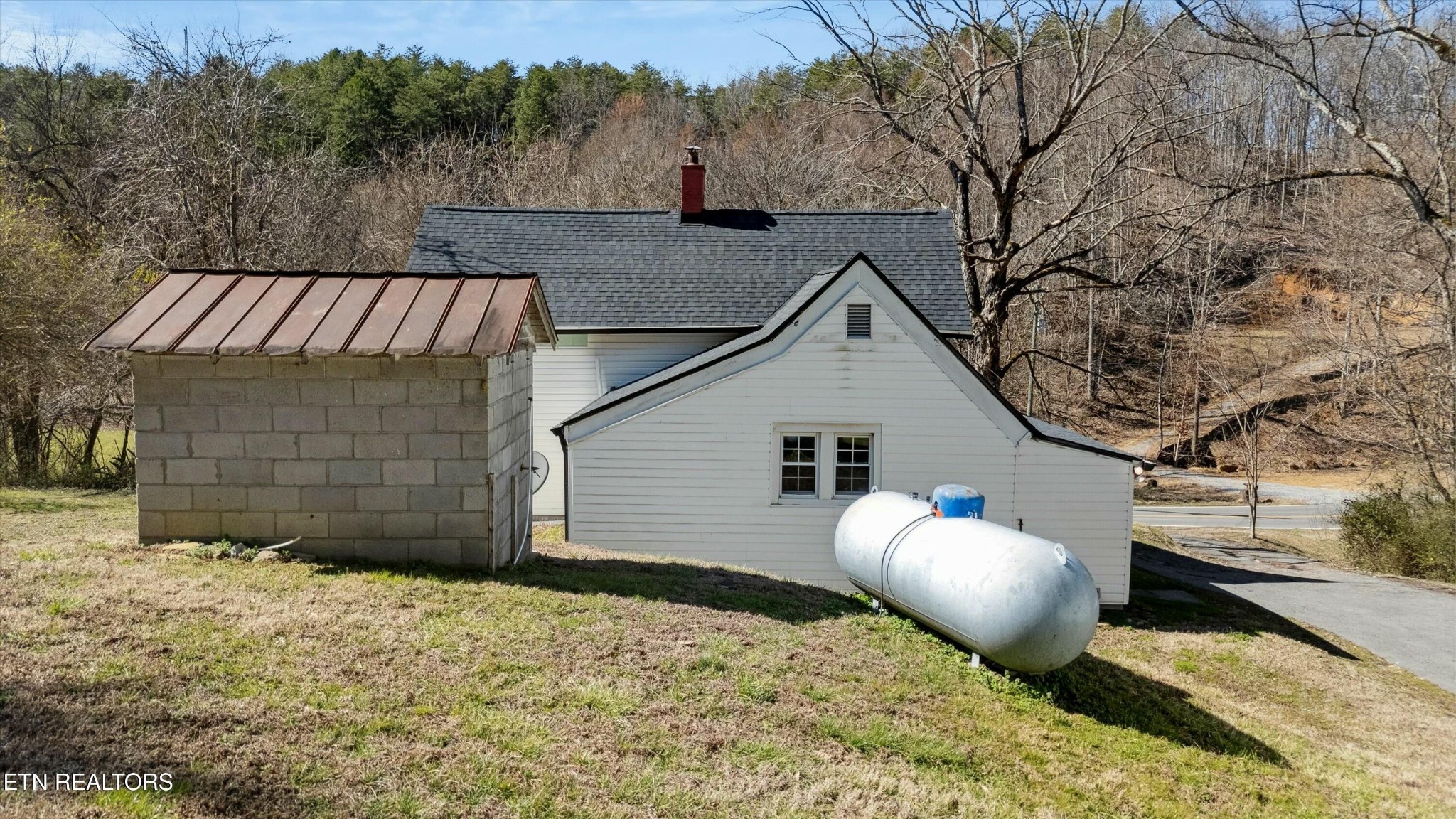 1216 Powder Springs Road Sevierville, TN 37876 - Photo 34 of 45 a view of a house with a yard and wooden fence