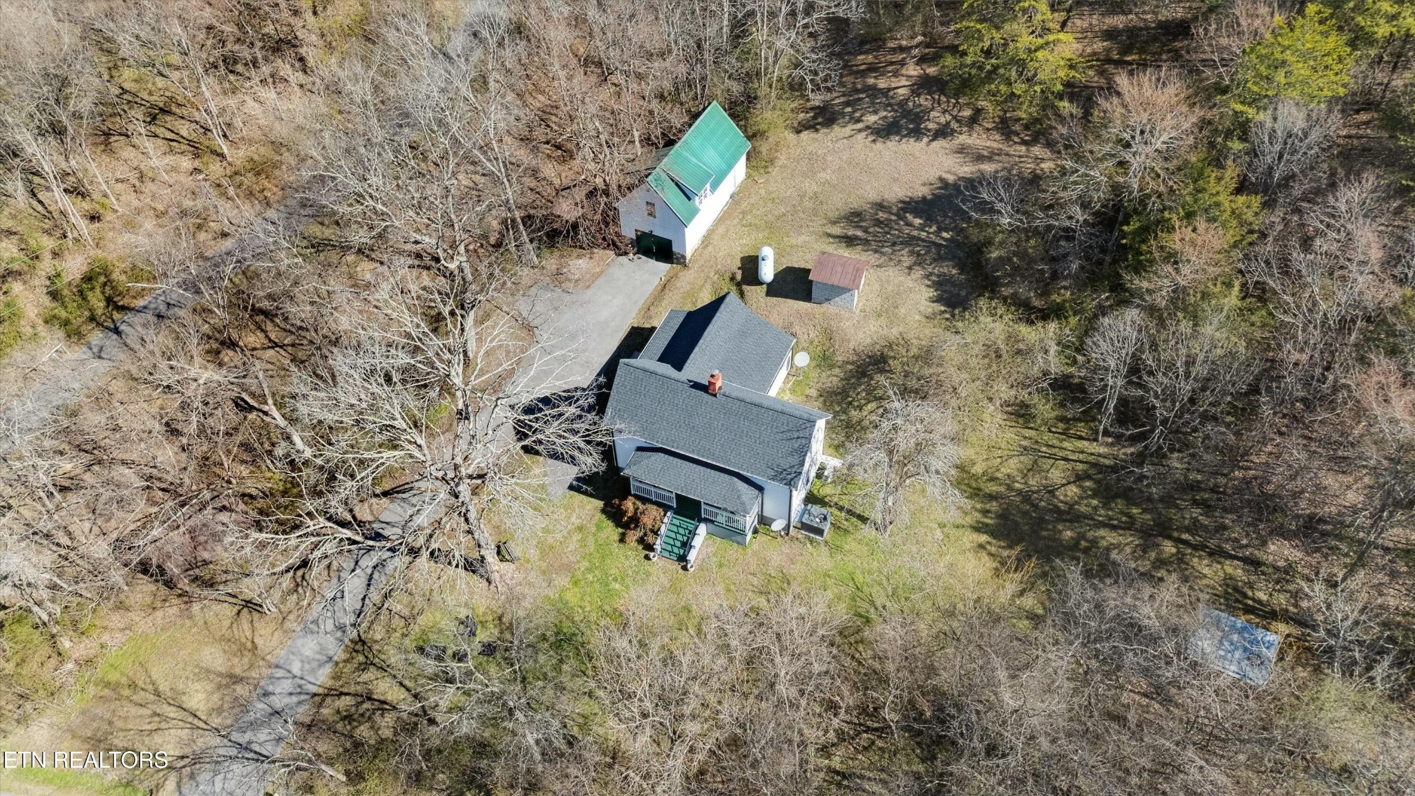 1216 Powder Springs Road Sevierville, TN 37876 - Photo 39 of 45 a backyard of a house with a yard and outdoor seating