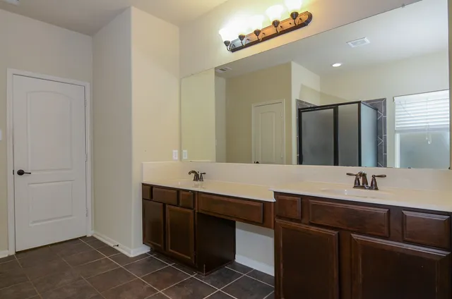 a white bath tub sitting next to a window