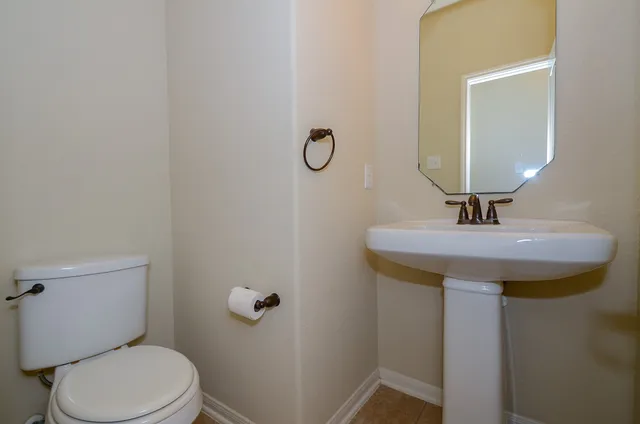 a bathroom with a sink vanity and a mirror