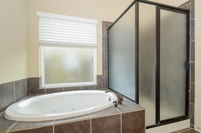 a kitchen with granite countertop a sink stove and cabinets