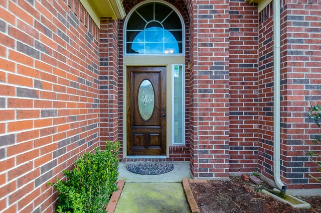 a view of a entryway door with wooden floor