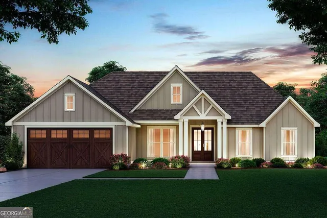 a front view of a house with a garden