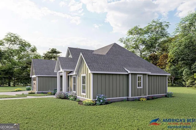 a front view of a house with a garden and yard