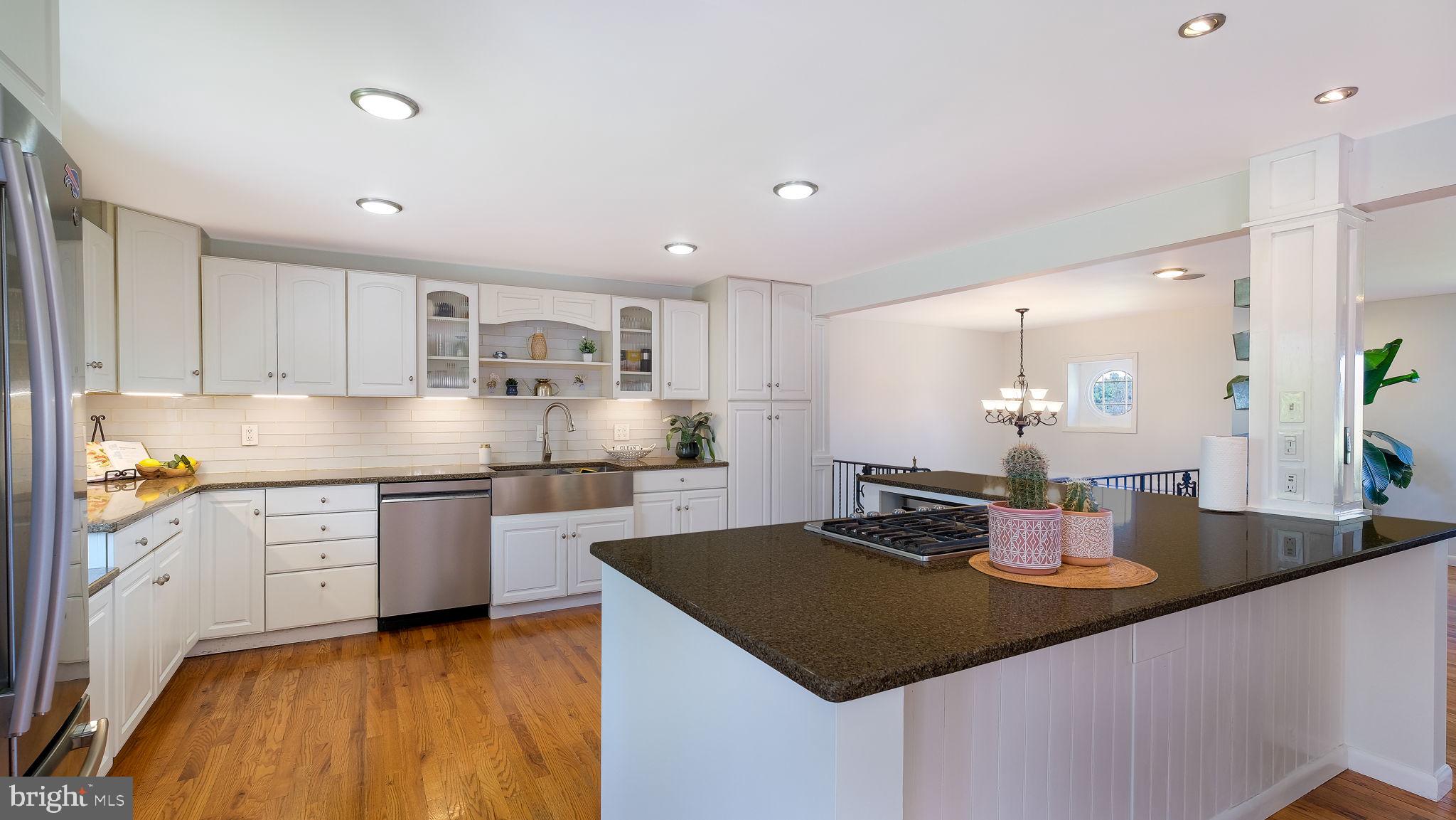 152 Blooming Glen Road Perkasie, PA 18944 - Photo 13 of 37 a kitchen with stainless steel appliances granite countertop a sink counter space and cabinets