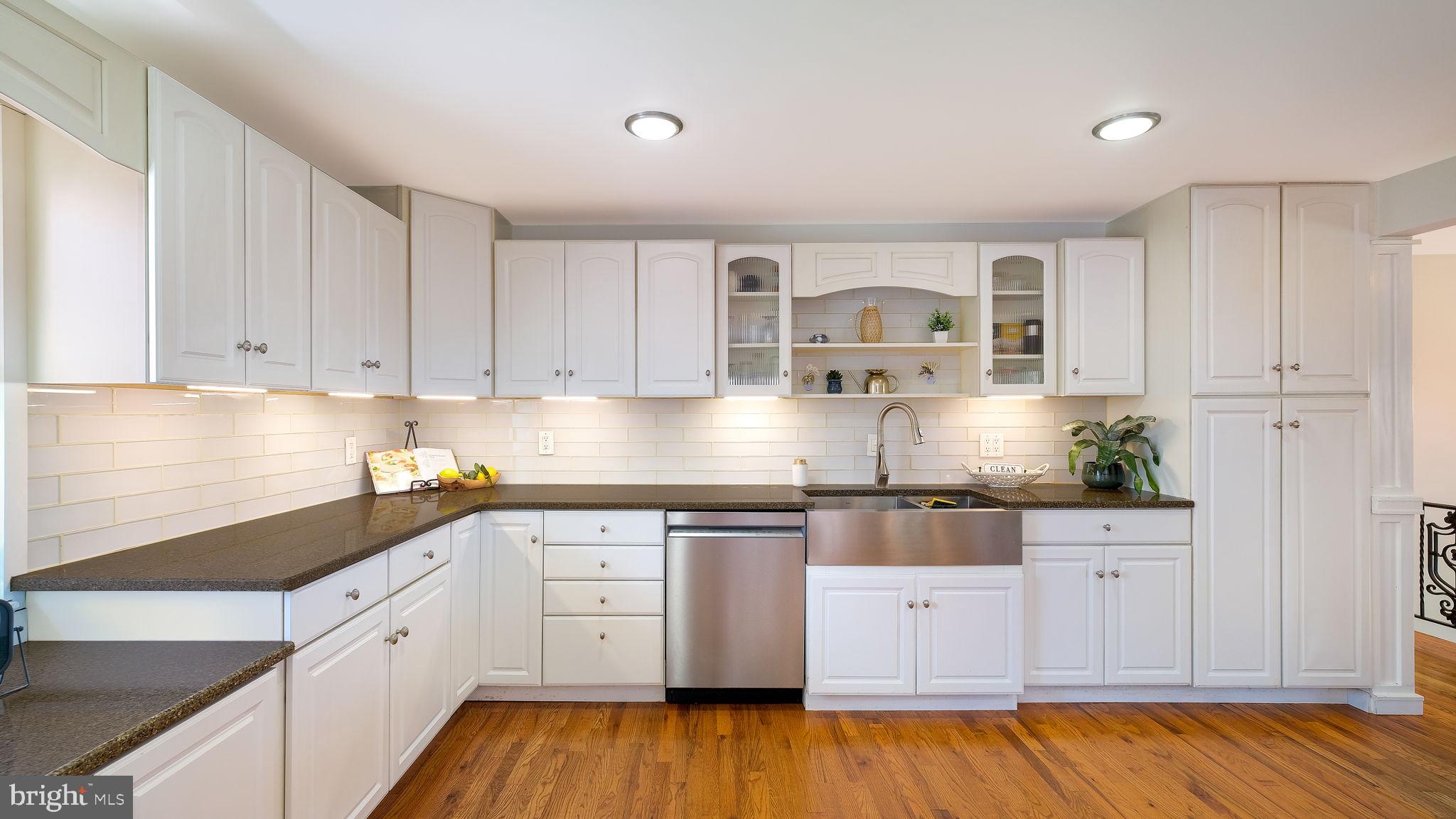 152 Blooming Glen Road Perkasie, PA 18944 - Photo 14 of 37 a kitchen with granite countertop white cabinets and white appliances