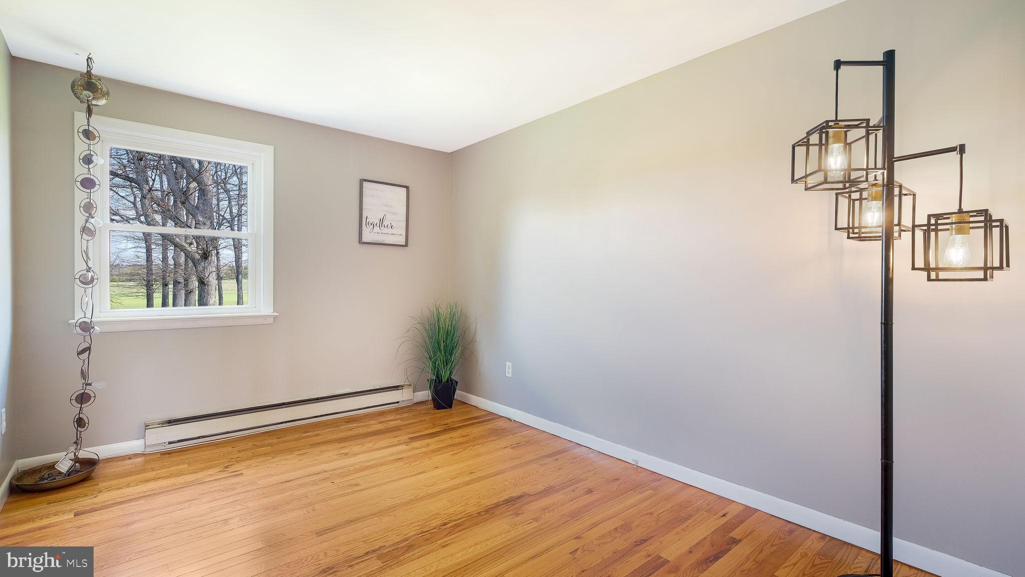 152 Blooming Glen Road Perkasie, PA 18944 - Photo 22 of 37 a view of empty room with wooden floor and fan