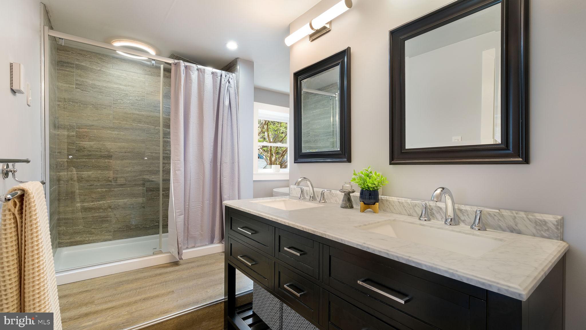 152 Blooming Glen Road Perkasie, PA 18944 - Photo 27 of 37 a bathroom with double vanity sinks and a mirror