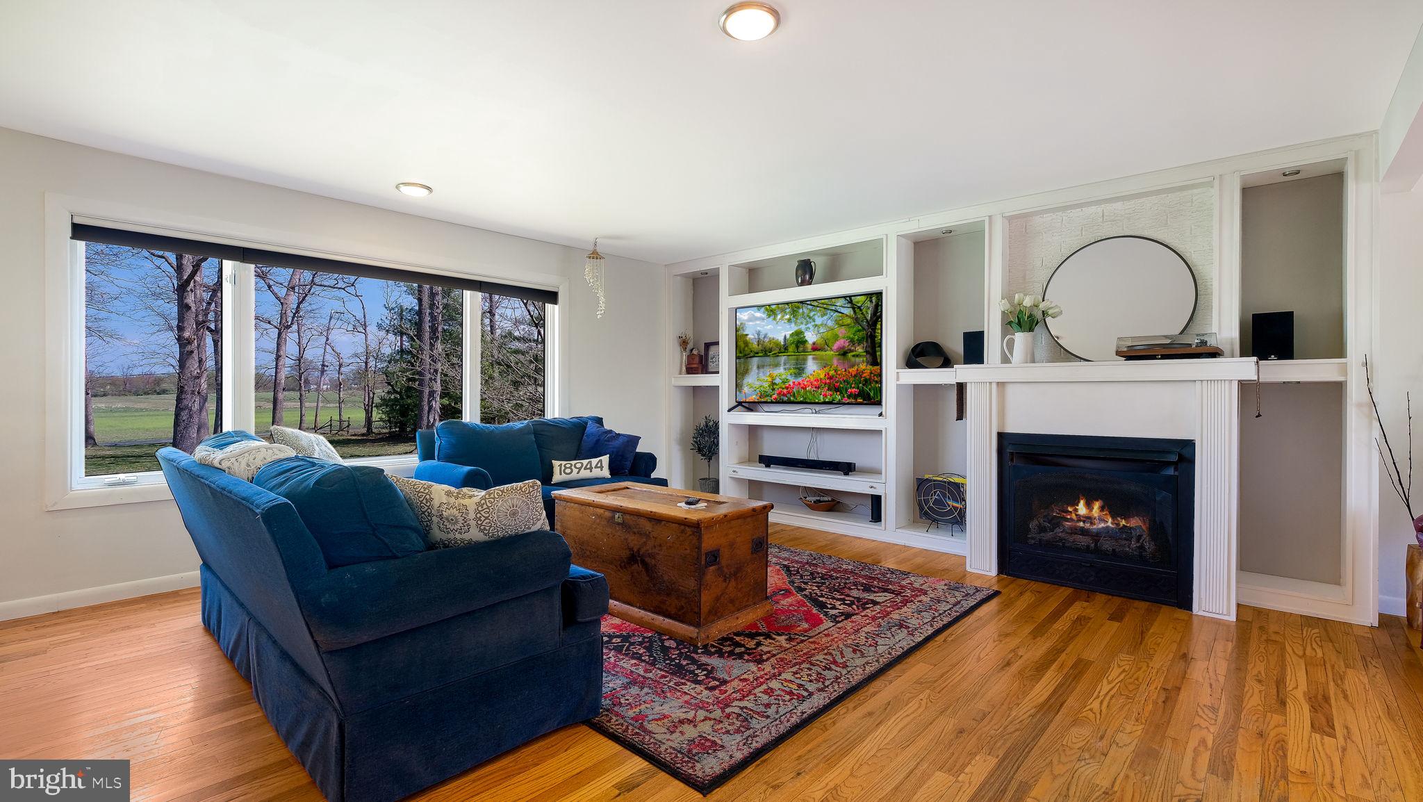 152 Blooming Glen Road Perkasie, PA 18944 - Photo 8 of 37 a living room with furniture and a fireplace