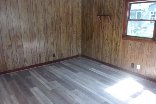 a view of a room with wooden walls