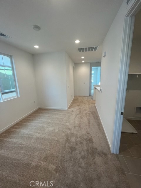 31373 Trappers Loop Winchester, CA 92596 - Photo 12 of 15 en empty room with windows and yard