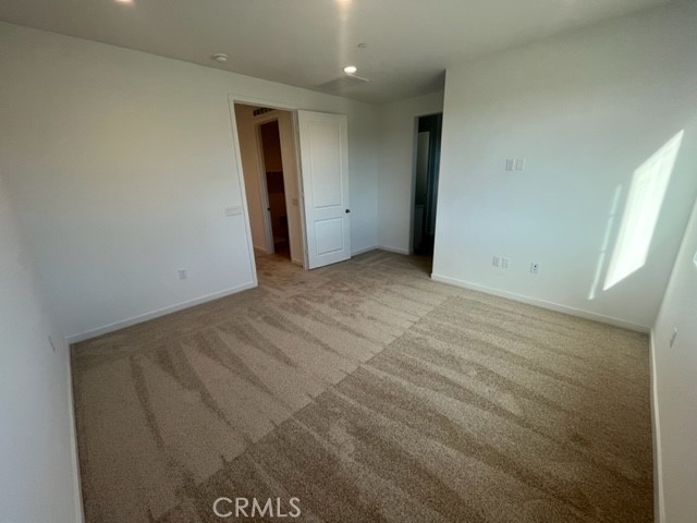 31373 Trappers Loop Winchester, CA 92596 - Photo 13 of 15 an empty room with a mirror