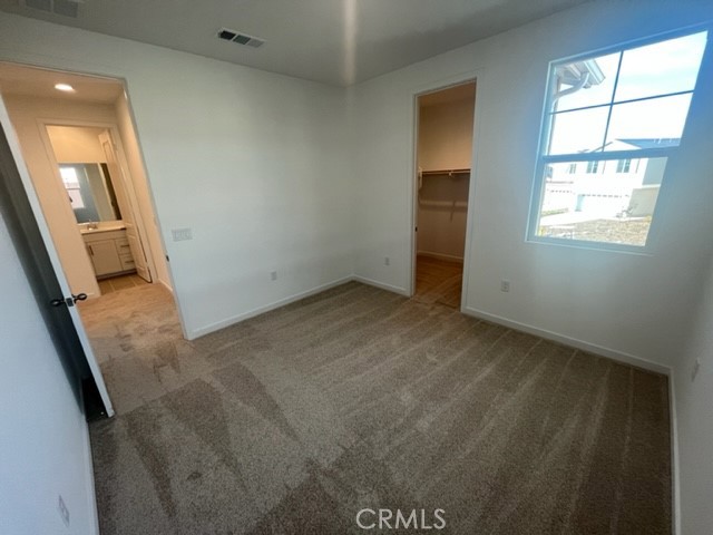 31373 Trappers Loop Winchester, CA 92596 - Photo 10 of 15 an empty room with windows