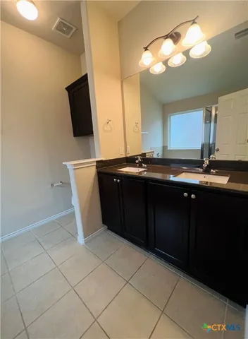 a kitchen with a sink and a refrigerator