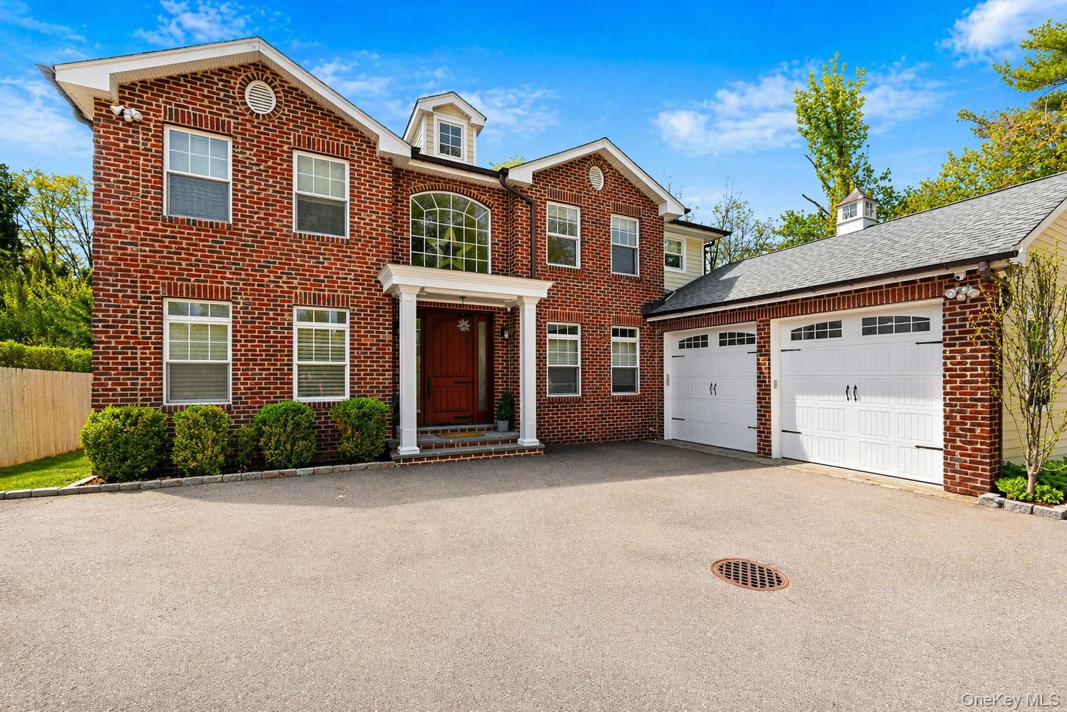Red brick exterior with white trim