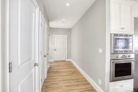 a view of a kitchen from the hallway