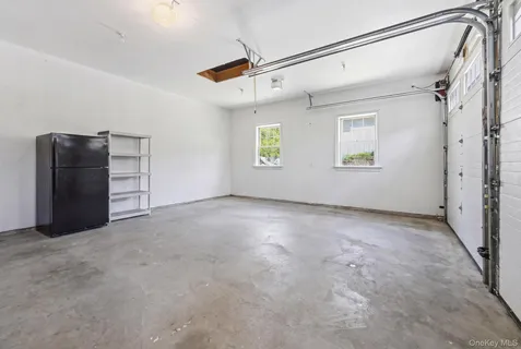 a view of a big room with closet and windows