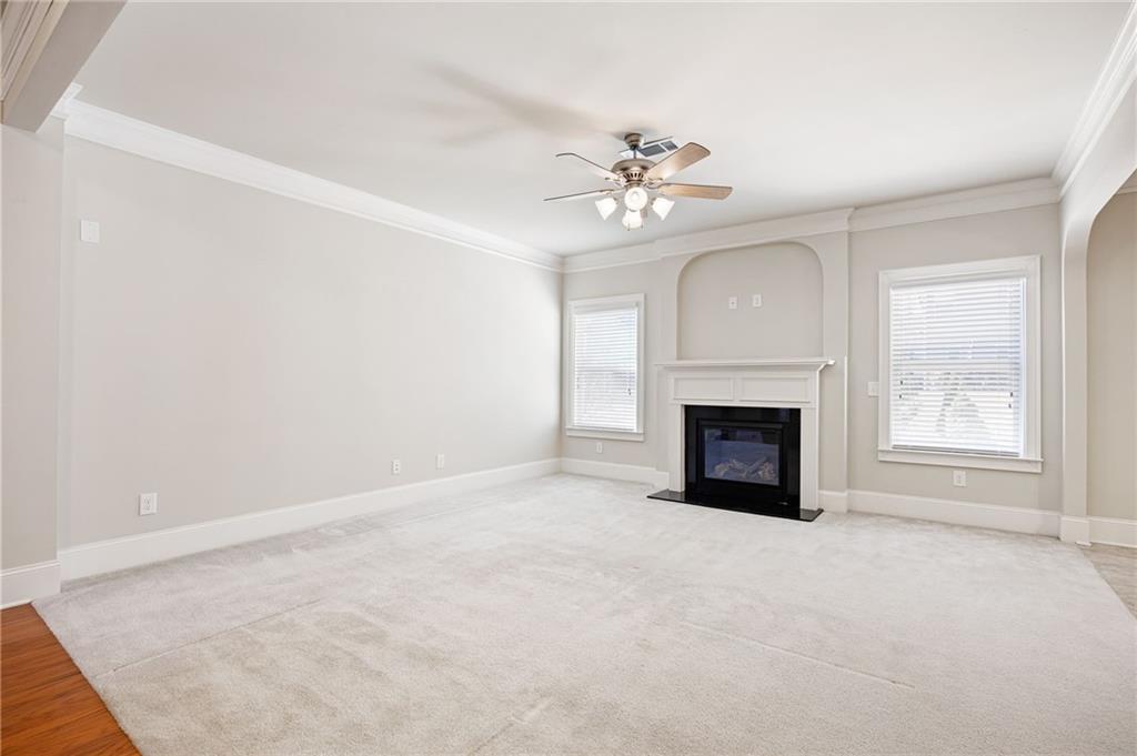 66 Lanier Ridge Acworth, GA 30101 - Photo 17 of 53 a view of a livingroom with a fireplace a ceiling fan and windows
