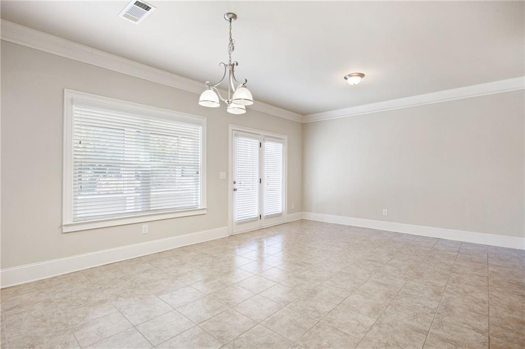 66 Lanier Ridge Acworth, GA 30101 - Photo 18 of 53 an empty room with chandelier fan and windows
