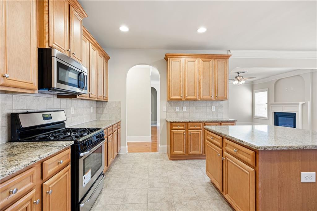 66 Lanier Ridge Acworth, GA 30101 - Photo 27 of 53 a kitchen with stainless steel appliances granite countertop a stove a sink and a microwave