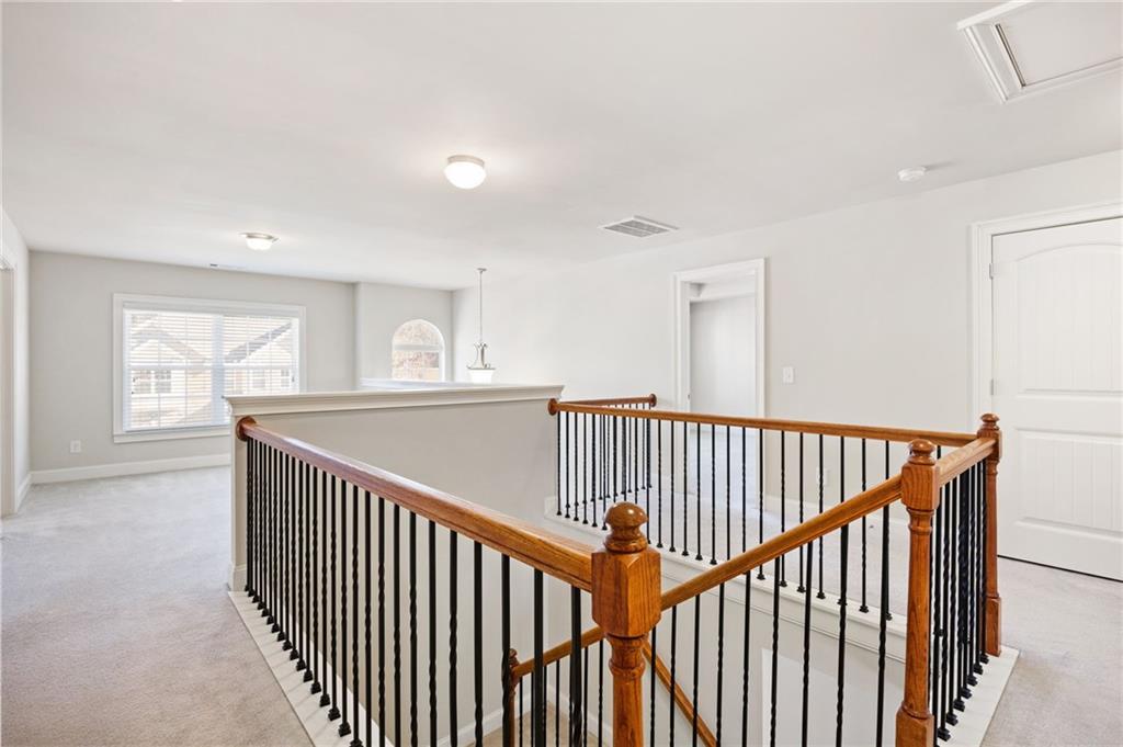 66 Lanier Ridge Acworth, GA 30101 - Photo 30 of 53 a view of a hallway with wooden floor and windows