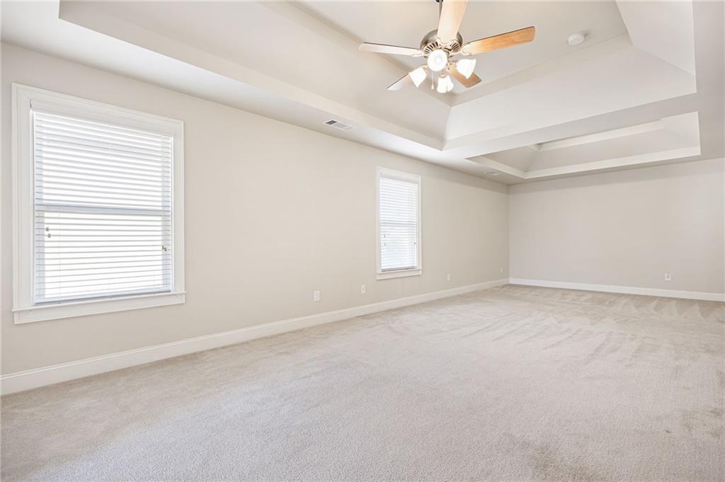 66 Lanier Ridge Acworth, GA 30101 - Photo 33 of 53 an empty room with a window and a ceiling fan