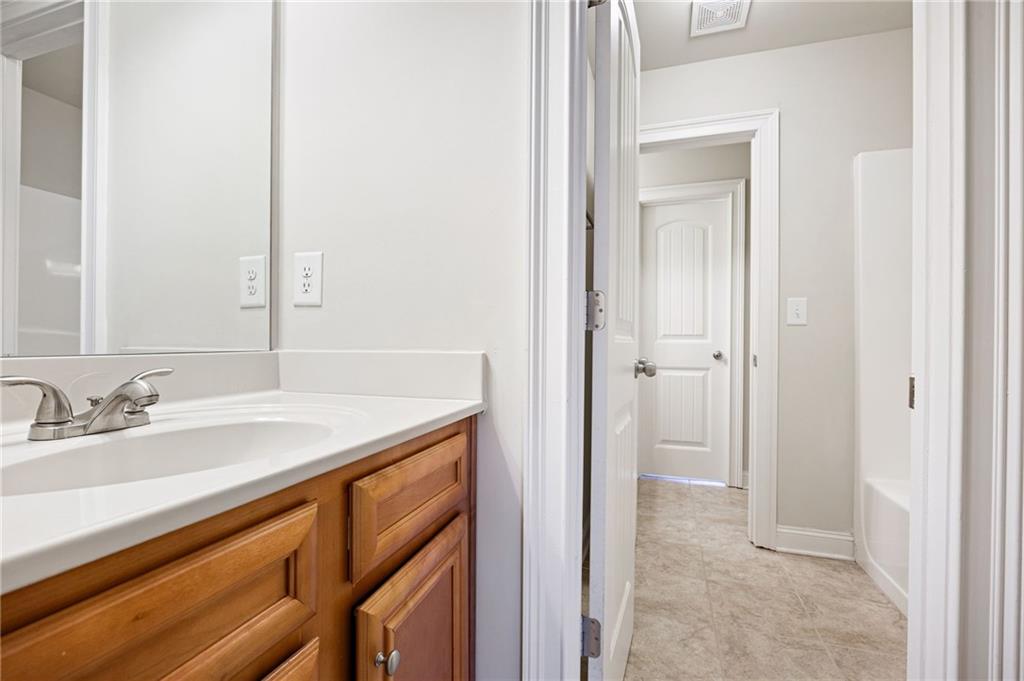 66 Lanier Ridge Acworth, GA 30101 - Photo 43 of 53 a bathroom with a sink and a mirror