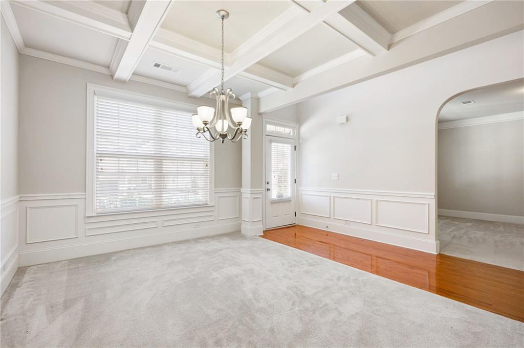66 Lanier Ridge Acworth, GA 30101 - Photo 10 of 53 an empty room with chandelier and windows