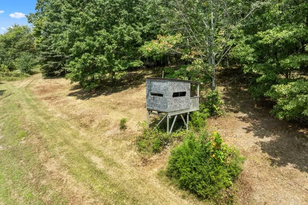 an aerial view of residential house with outdoor space