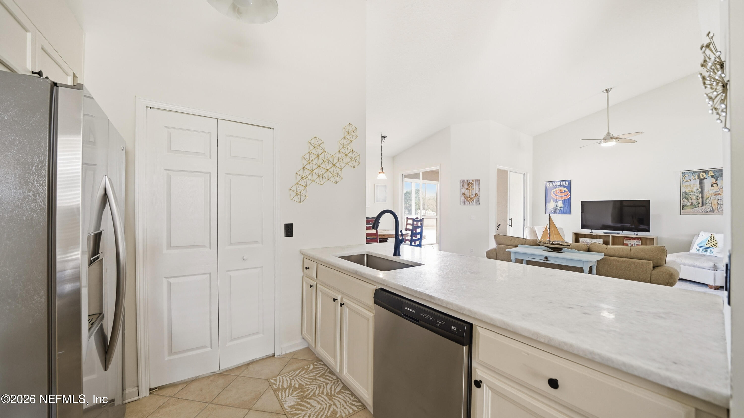705 Augusta Circle St. Augustine, FL 32086 - Photo 13 of 53 a kitchen with stainless steel appliances a sink a refrigerator a counter top space and cabinets