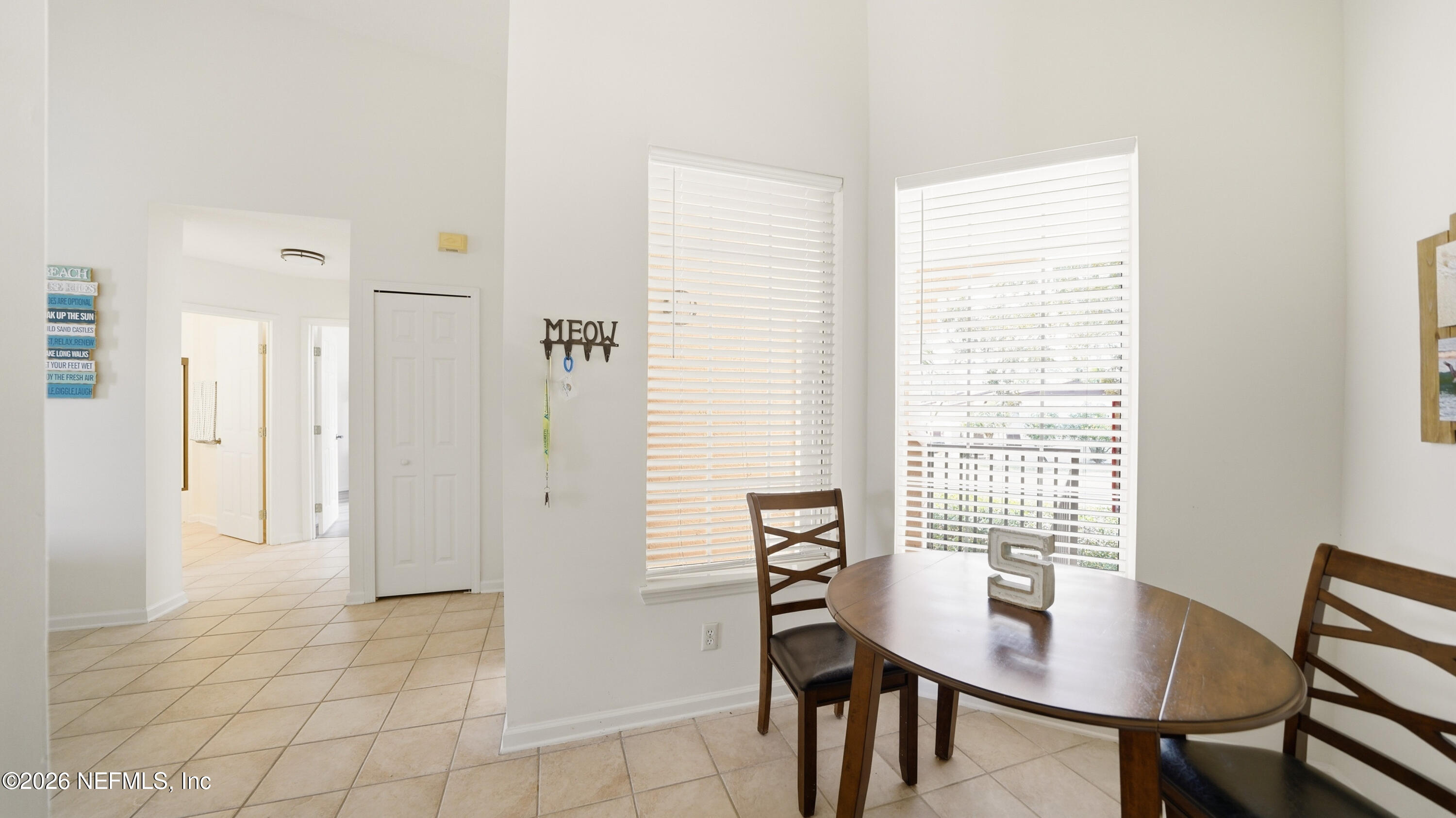705 Augusta Circle St. Augustine, FL 32086 - Photo 16 of 53 a view of a room with a table and chairs