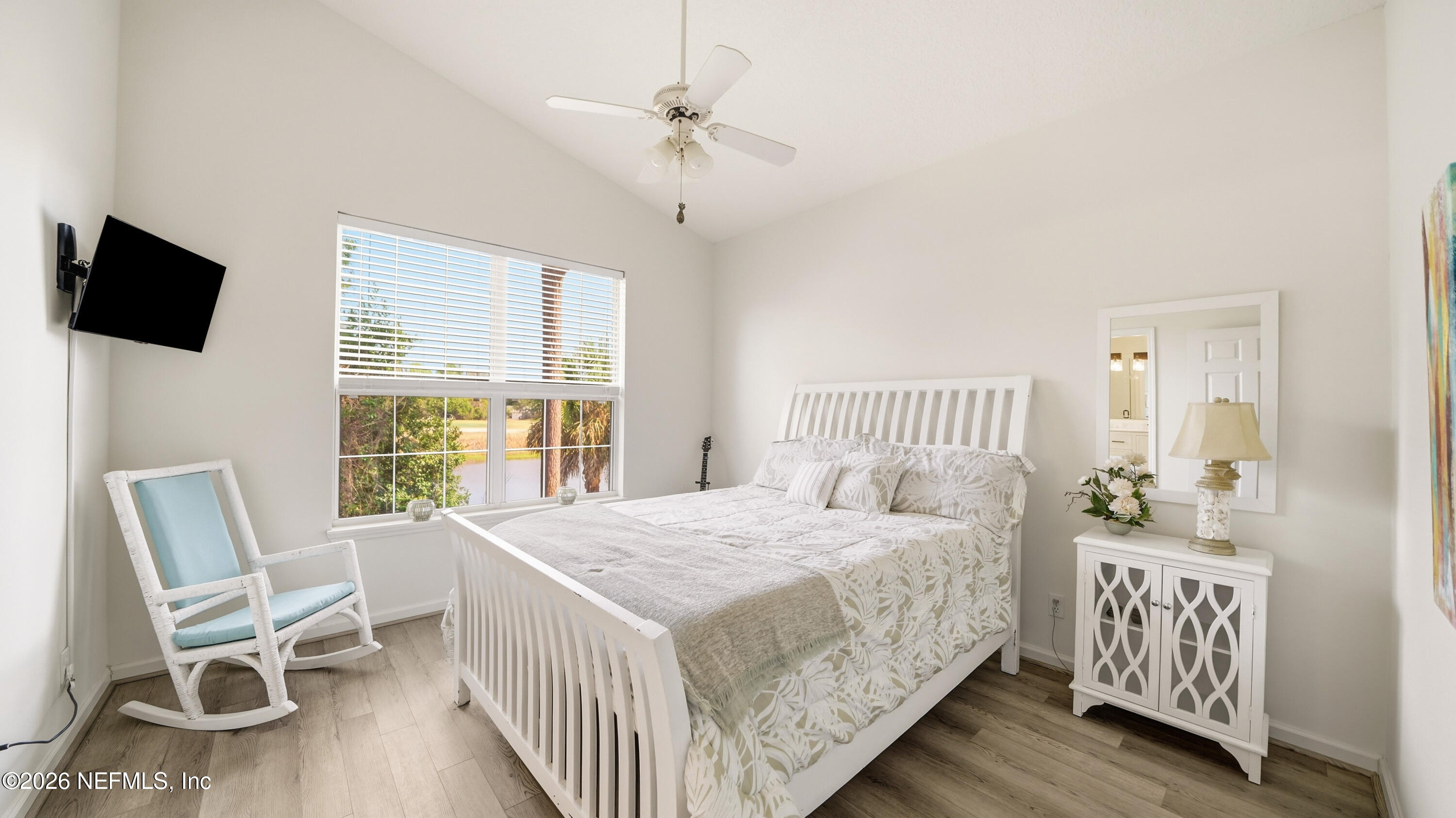 705 Augusta Circle St. Augustine, FL 32086 - Photo 19 of 53 a bedroom with a bed and a table