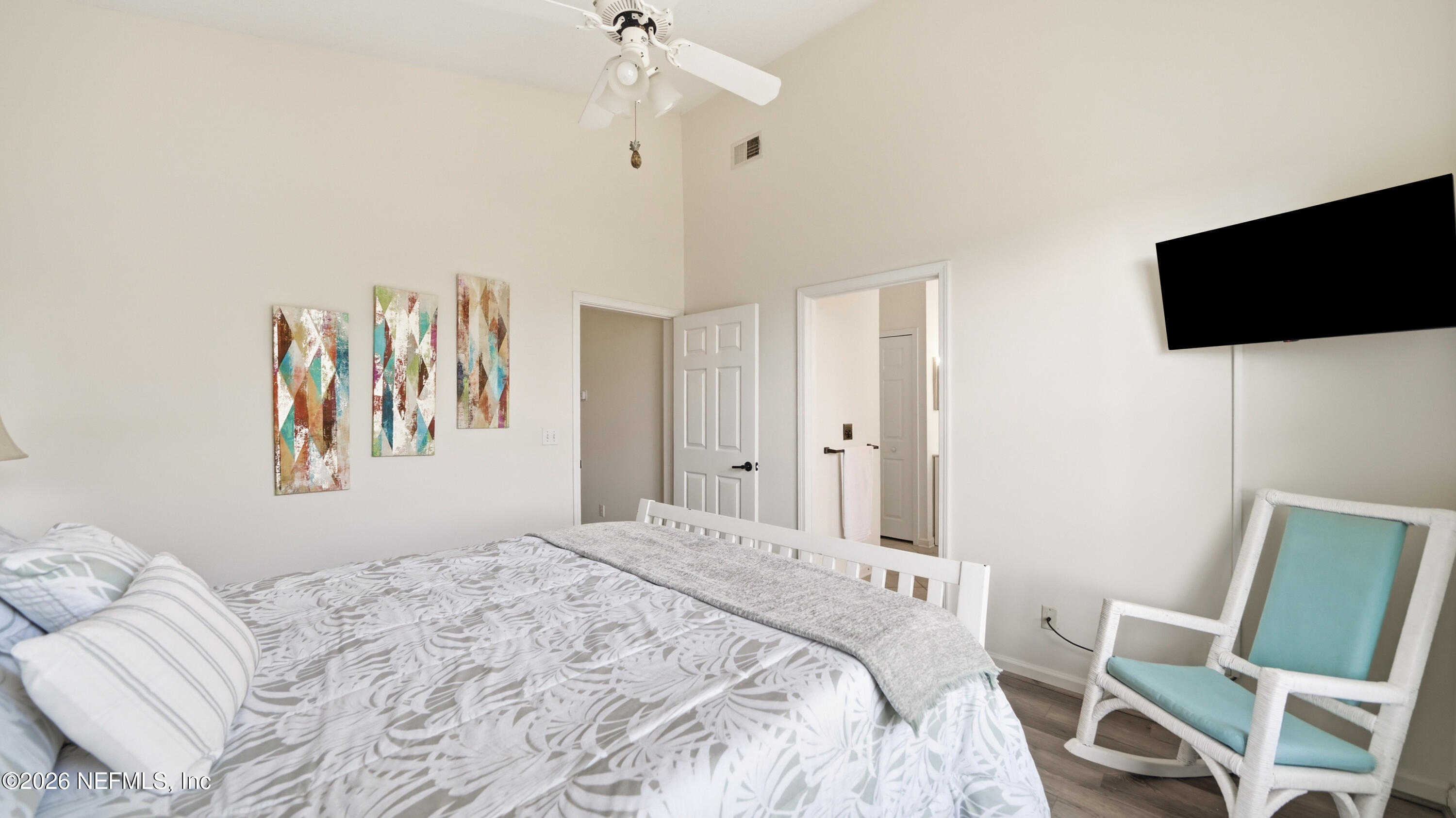 705 Augusta Circle St. Augustine, FL 32086 - Photo 20 of 53 a bedroom with a bed tv and a window
