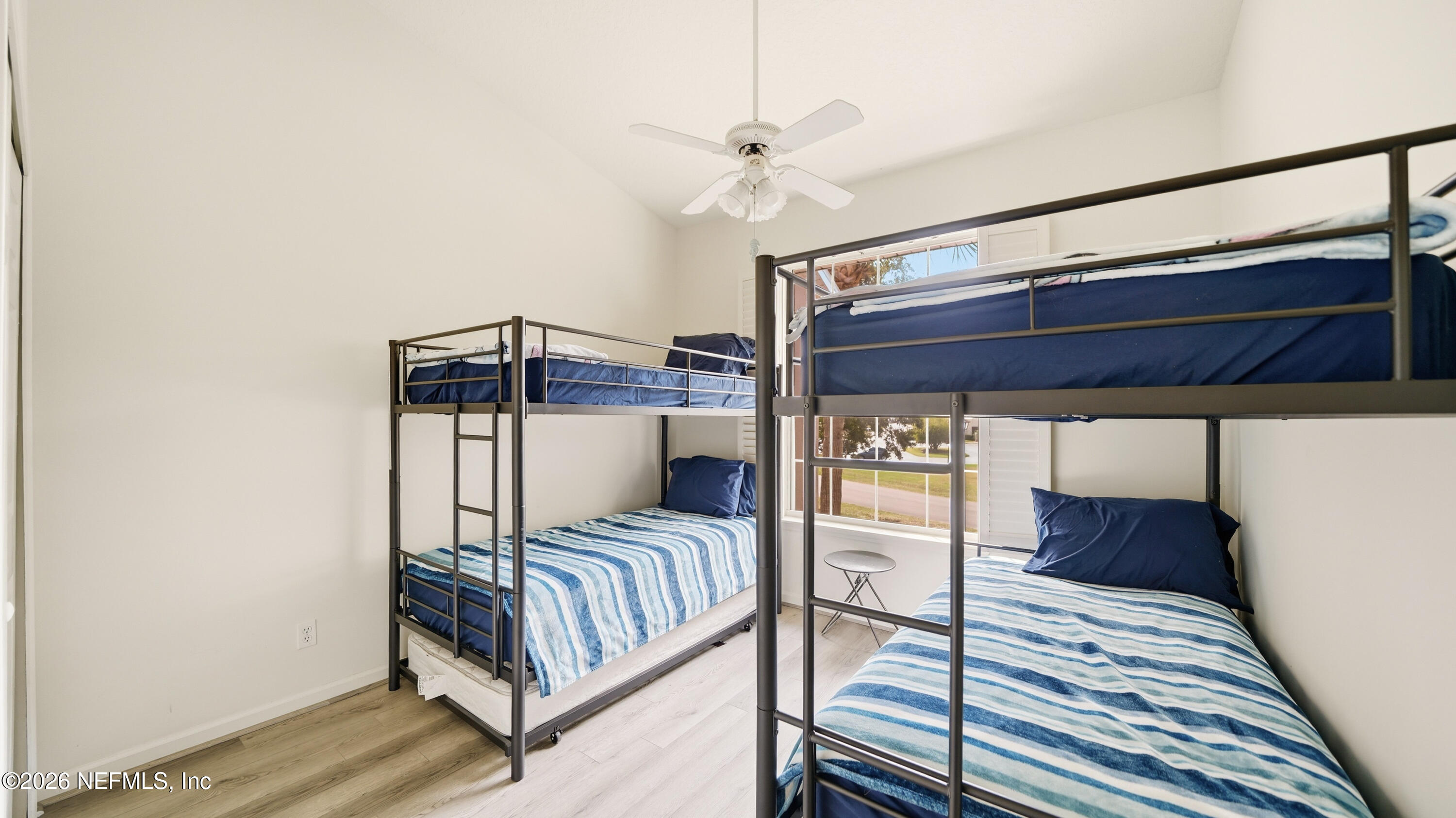 705 Augusta Circle St. Augustine, FL 32086 - Photo 31 of 53 a bedroom with a bed and a mirror