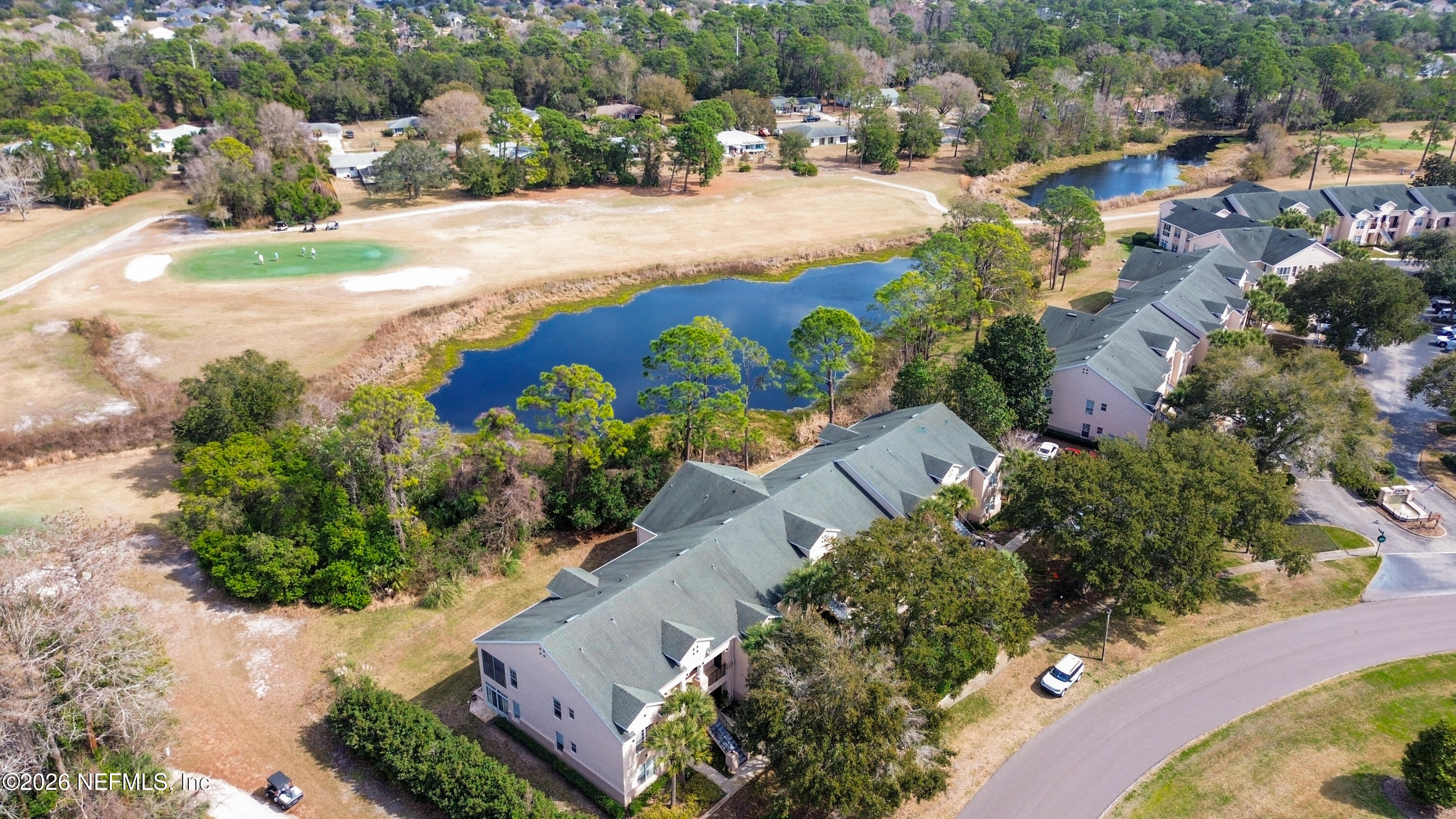 705 Augusta Circle St. Augustine, FL 32086 - Photo 46 of 53 an aerial view of a house with a yard and lake view