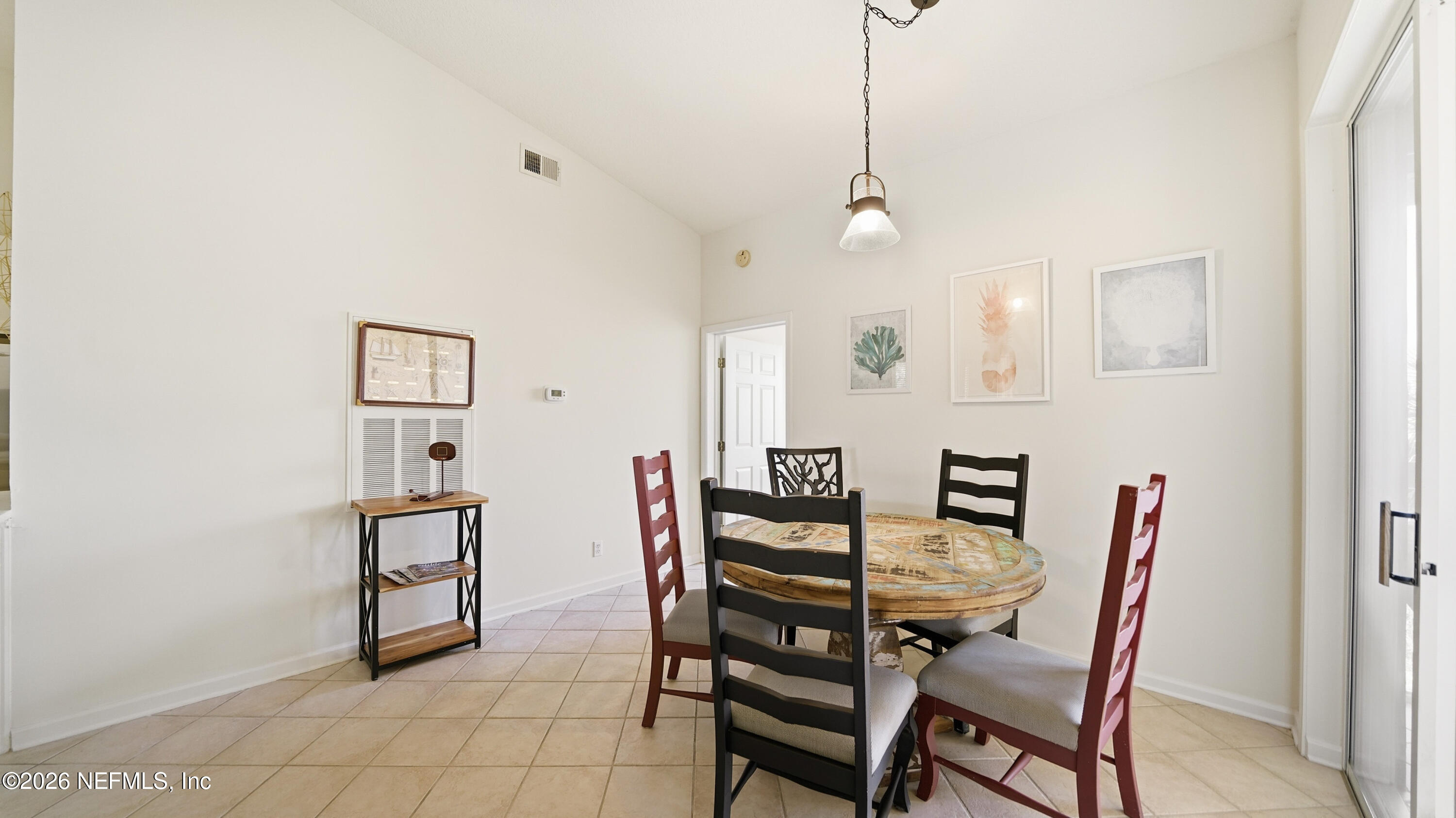 705 Augusta Circle St. Augustine, FL 32086 - Photo 8 of 53 a view of a dining room with furniture