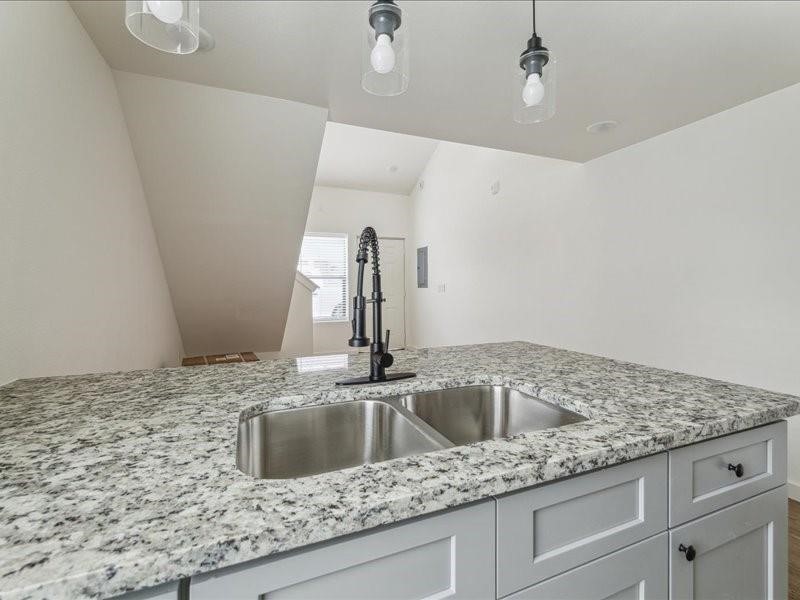 905 74th Street, Unit 3 Houston, TX 77011 - Photo 7 of 10 a kitchen with a sink and vanity