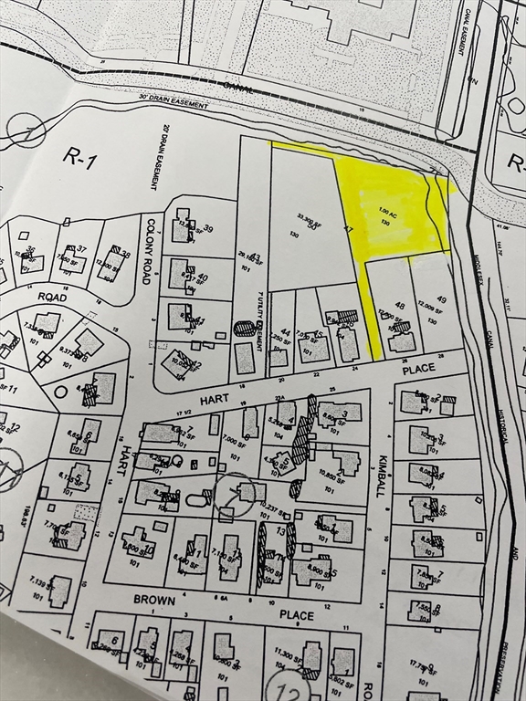 0 Hart Place Woburn, MA 01801 - Photo 1 of 1 a sign on the side of a building