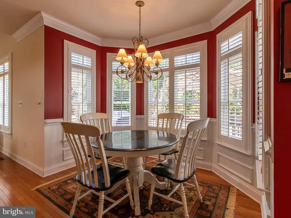 a dining room with furniture window wooden floor
