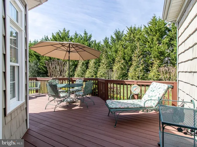 a view of sitting area with furniture and umbrella