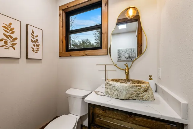 a bathroom with a glass shower door