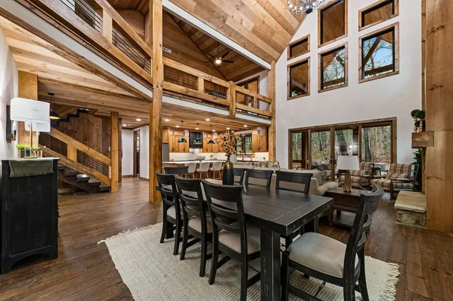 a view of a hallway with wooden floor and entryway