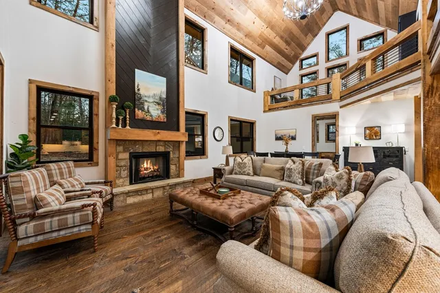 a bathroom with a granite countertop sink a mirror and a shower